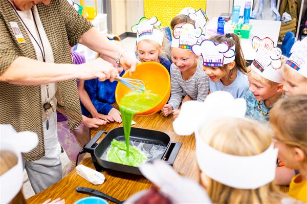 Students learning about Green Eggs and Ham and how to make them. 